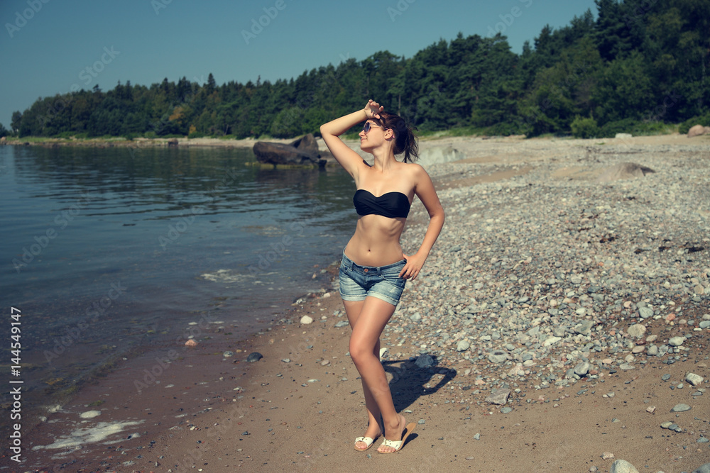 Fototapeta premium portrait beautiful smiling woman in black bikini