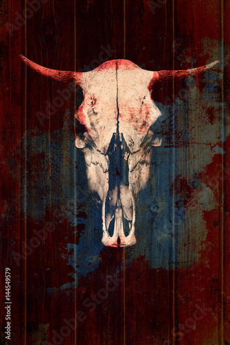 Creative skull of a bull on a wooden background. Skull with bloody horns. Creative photography with double exposure effect
