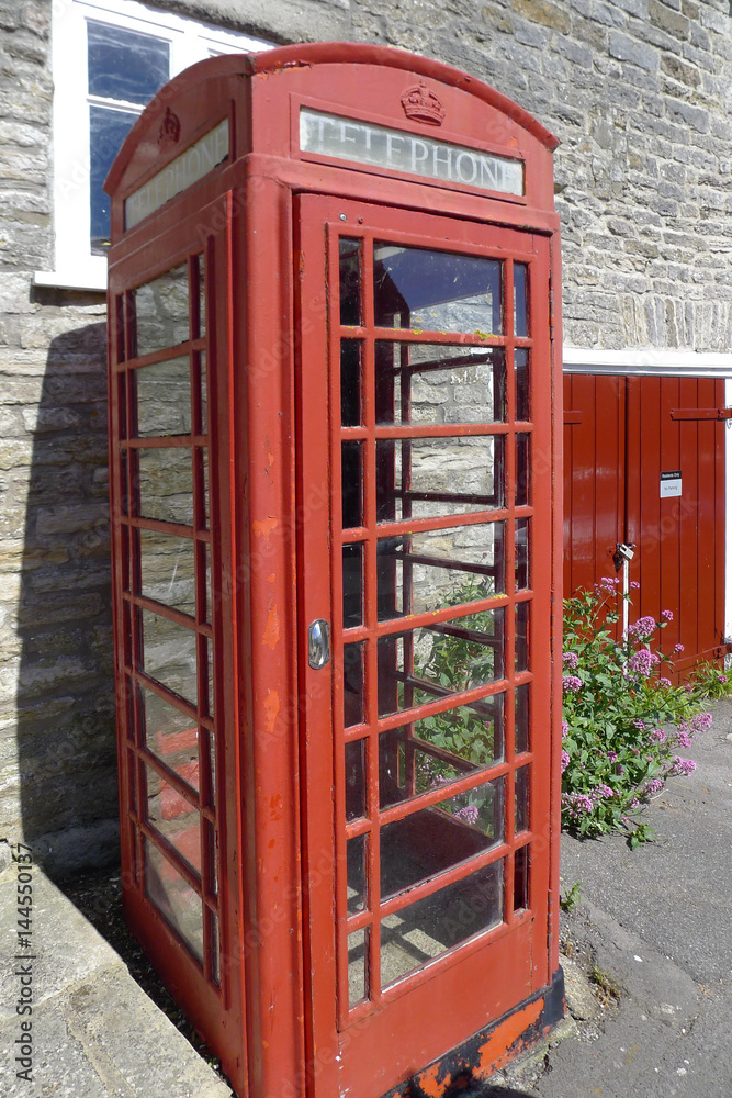 red old telephone box in England Cornwall red old telephone box in England Cornwall