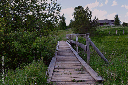 Fototapeta Naklejka Na Ścianę i Meble -  wood bridge  path nature stairs trees village  greens summer desolation day