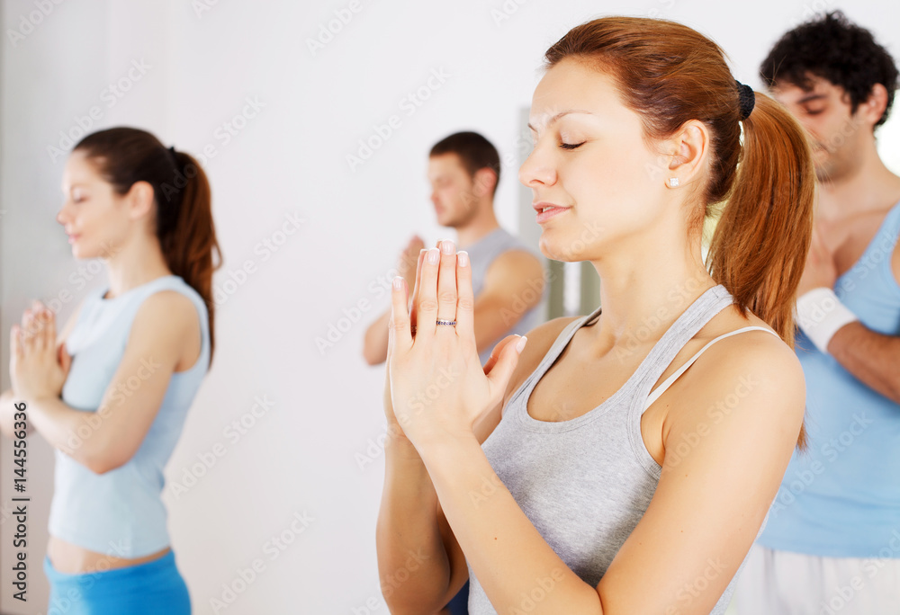 Group of people doing yoga exercise. Group of people doing yoga exercise.