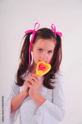 Girl with a lollipop in her hands