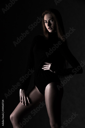 Young woman in a slim body dress