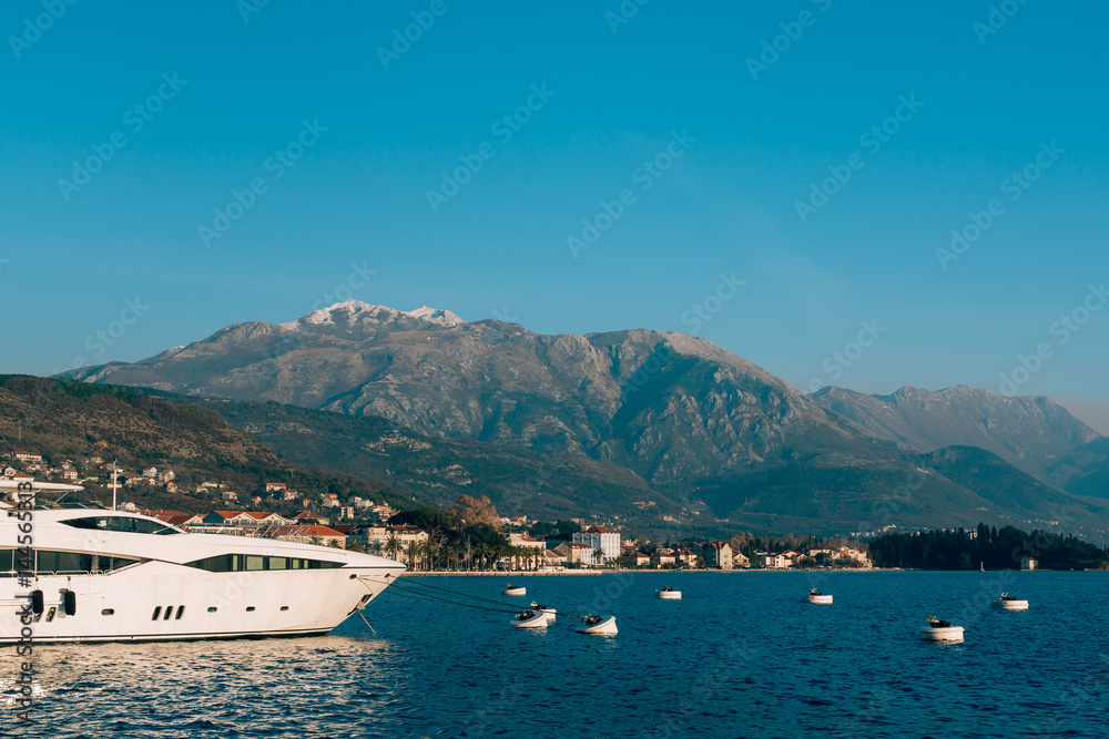 Lovcen in the snow. Snow on the mountain. View from Tivat. Waterfront Tivat in Montenegro.