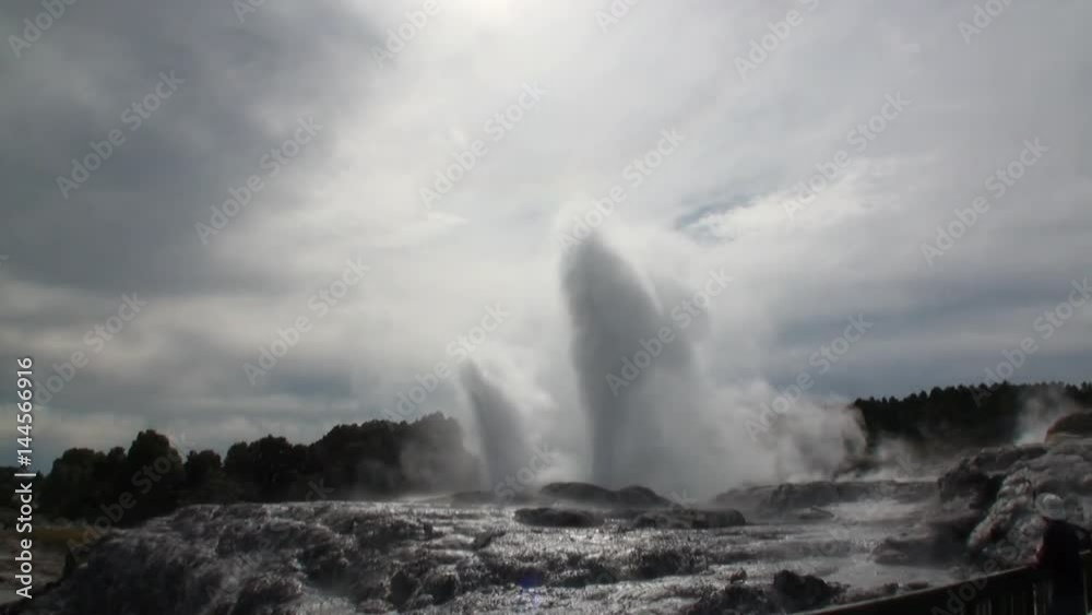 Geysers hot springs on background of forest and sky horizon in New Zealand. Beautiful amazing nature. Travel and tourism in the world of wildlife. Geysers hot springs on background of forest and sky horizon in New Zealand. Beautiful amazing nature. Travel and tourism in the world of wildlife.