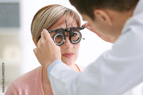 Ophthalmologist examining e...