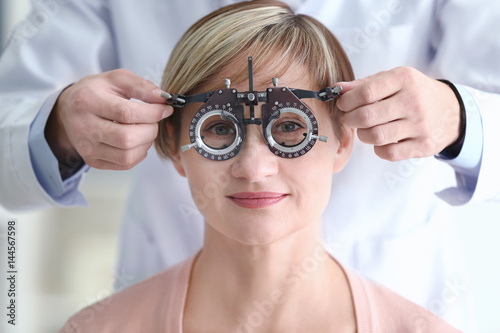 Ophthalmologist examining e...