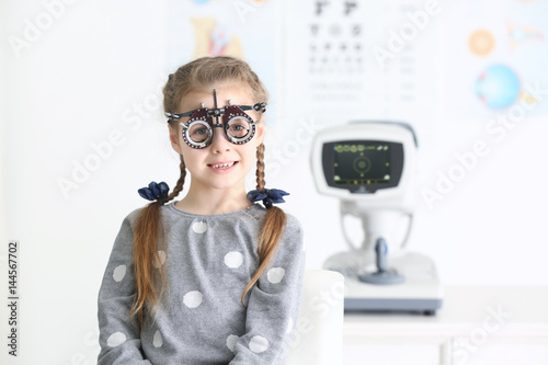 Cute little girl with trial...