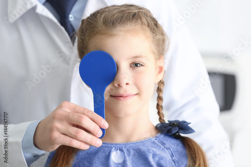 Ophthalmologist examining e...