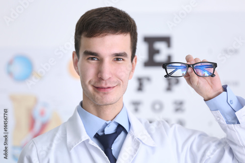 Handsome young ophthalmolog...