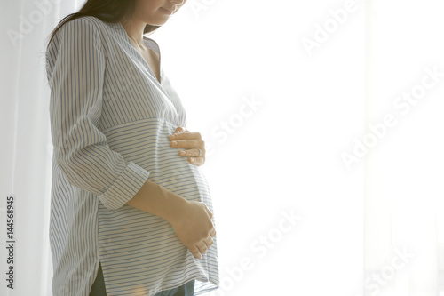 Beautiful pregnant woman st...