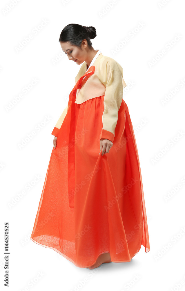 Beautiful young woman dressed in traditional clothing on white background Beautiful young woman dressed in traditional clothing on white background