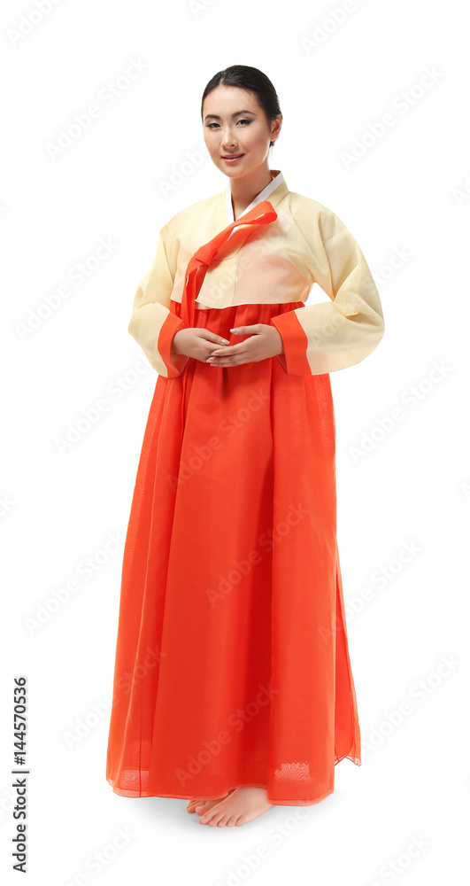 Beautiful young woman dressed in traditional clothing on white background Beautiful young woman dressed in traditional clothing on white background