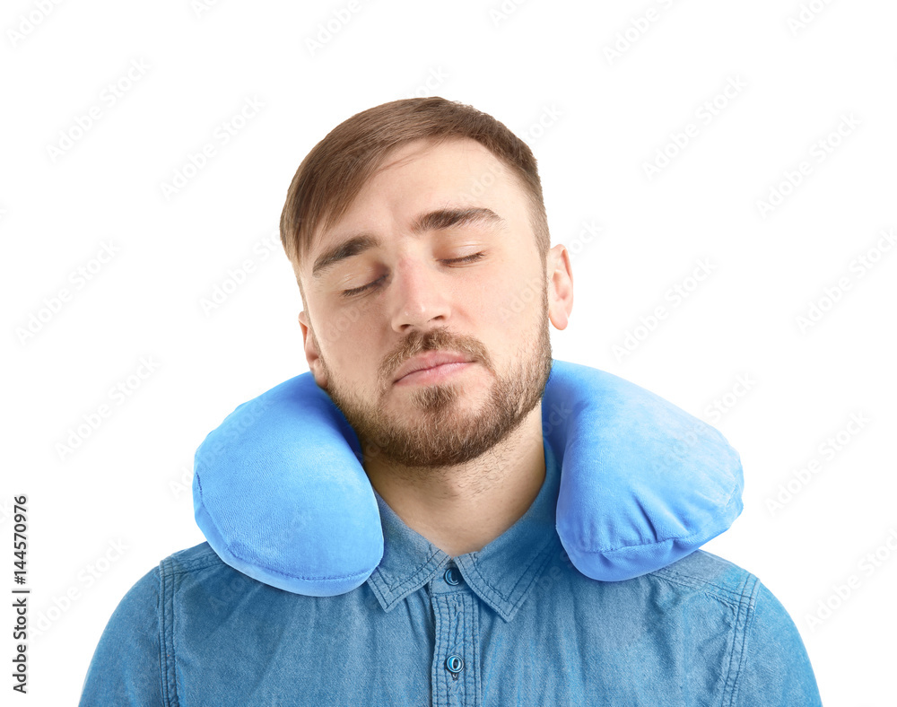 Young man with travel pillow on white background Young man with travel pillow on white background