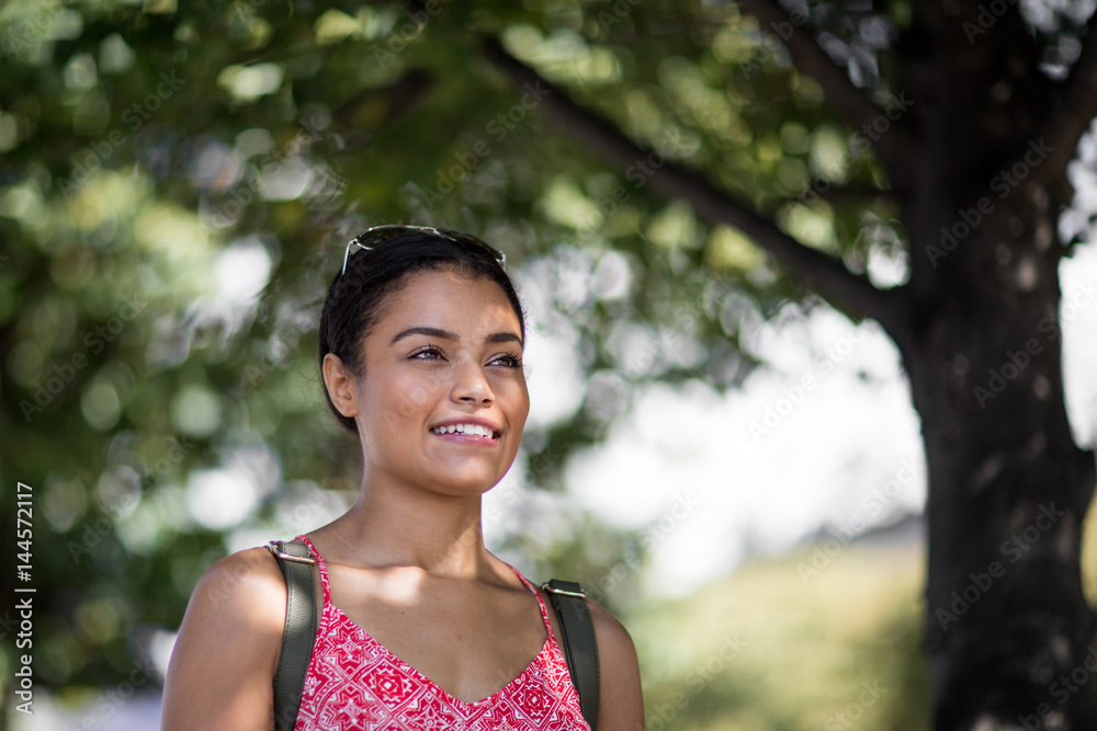 Young adult female walking outdoors Young adult female walking outdoors