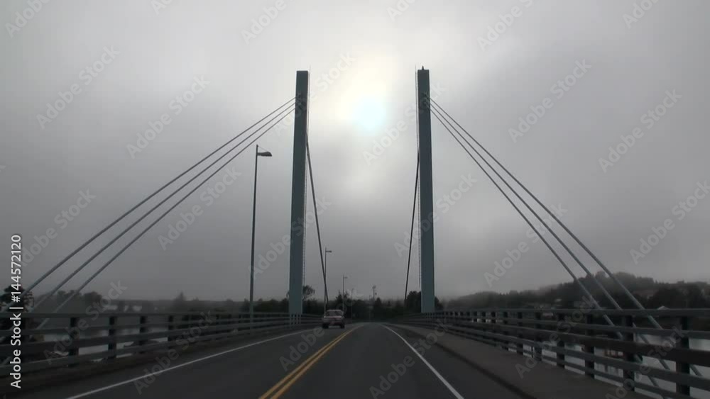 Road bridge over the Pacific Ocean in Sitka. Beautiful rest and tourism in a cool climate. Unique picture of nature in America. Road bridge over the Pacific Ocean in Sitka. Beautiful rest and tourism in a cool climate. Unique picture of nature in America.
