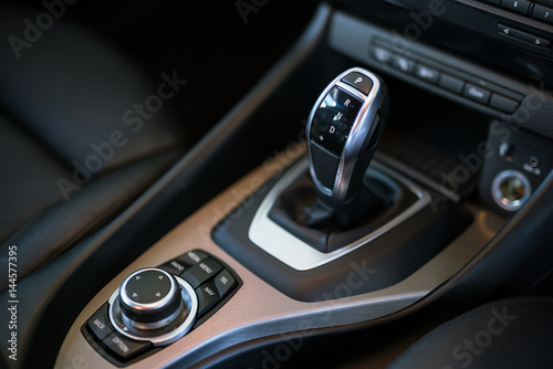 Detail of modern car interior, gear stick, automatic transmission in expensive car © KissShot