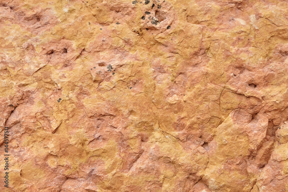 Beautiful old red stone wall texture background.
