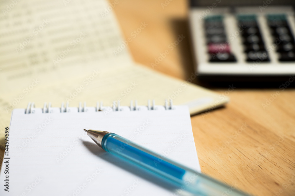 Background of passbook, note book with pen, calculator Background of passbook, note book with pen, calculator