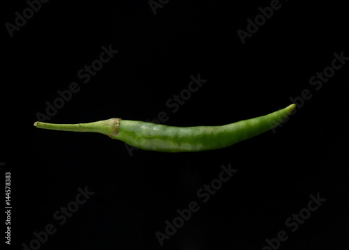 chilli pepper on black background photo