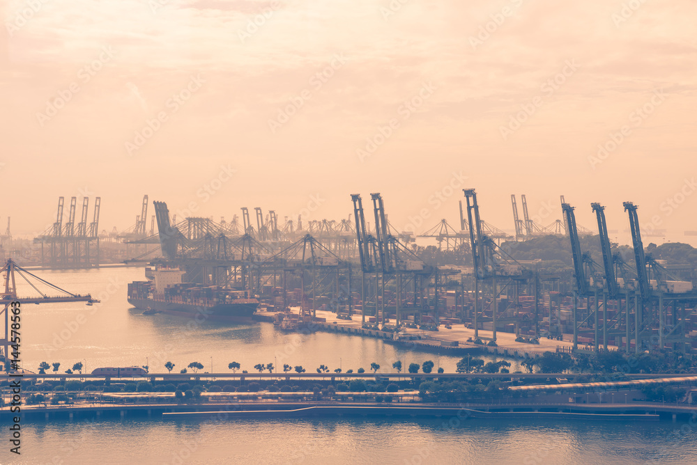 Container Cargo freight ship with working crane bridge in shipyard Container Cargo freight ship with working crane bridge in shipyard