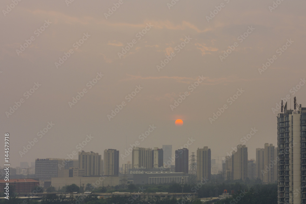 High angle horizontal building shot of sunset in beijing on a foggy day