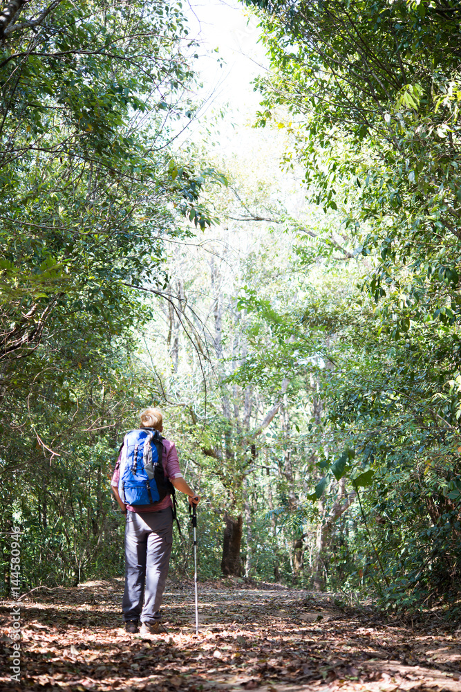 Adventure young man hiking in the mountains with a backpack. Adventure young man hiking in the mountains with a backpack.