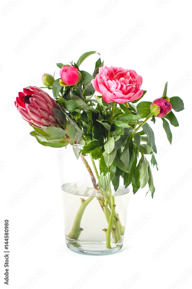 Bright bouquet of freshly cut flowers in a glass vase on a clean white background.. Bright bouquet of freshly cut flowers in a glass vase on a clean white background..