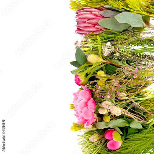Beautiful freshly cut flowers lie on a white background on the right..