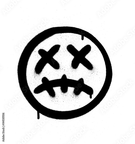 Graffiti scary sick emoji sprayed in black on white