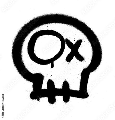 Graffiti emoji skull sprayed in black on white