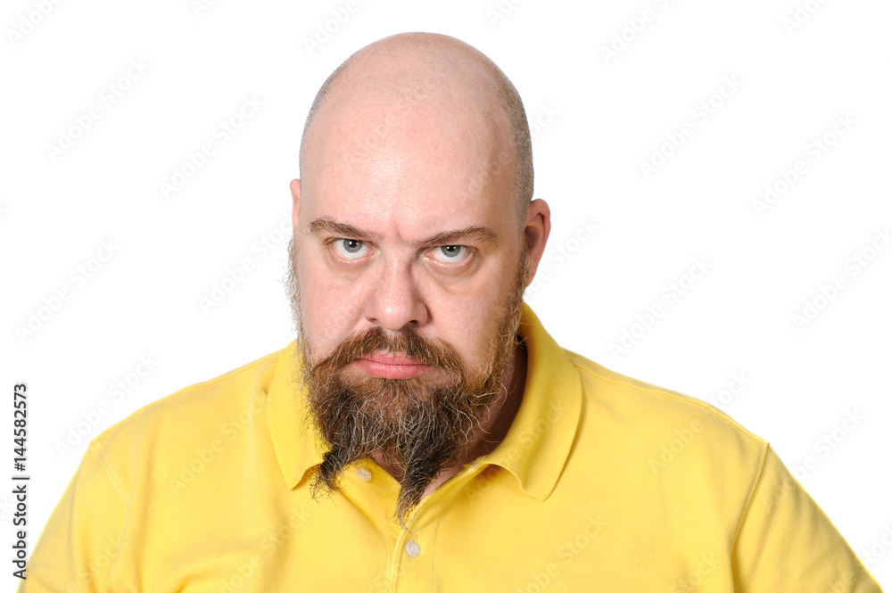 Angry middle-aged man in bright yellow clothes on a white background.. Angry middle-aged man in bright yellow clothes on a white background..