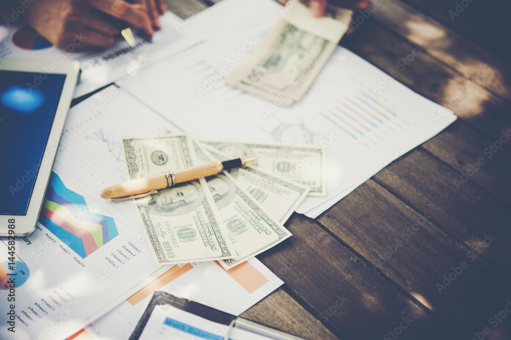 Business team workplace on a new business plan with money, Working in office. Business team workplace on a new business plan with money, Working in office.