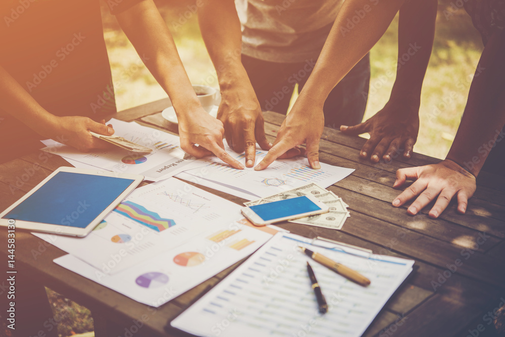 Group of business people analysis with marketing report graph, Young specialists are discussing business ideas for new digital start up project. Group of business people analysis with marketing report graph, Young specialists are discussing business ideas for new digital start up project.