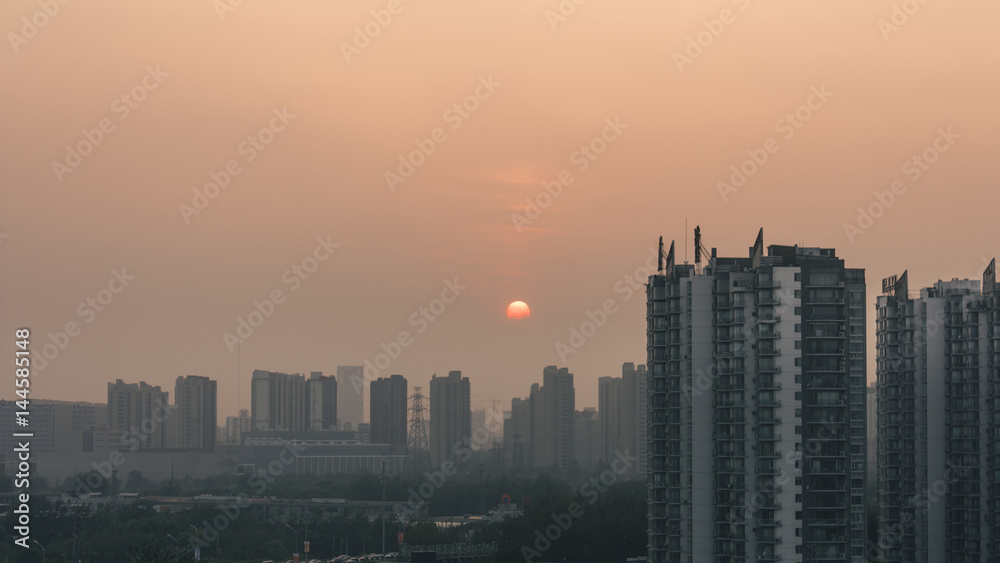 Fototapeta premium sunset in foggy beijing