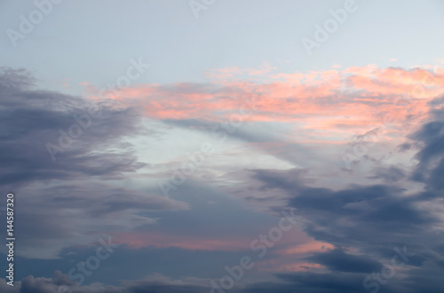 Sunset sky with golden and dark clouds. Sky cloud.  © Tata Chen
