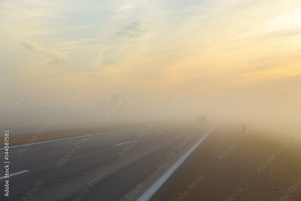 Frreway and a car in fog