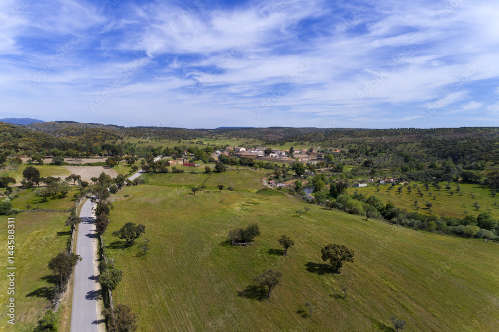 Aerial view of the road leading to the historic village of Idanha a Velha in Portugal; Concept for travel in Portugal Aerial view of the road leading to the historic village of Idanha a Velha in Portugal; Concept for travel in Portugal