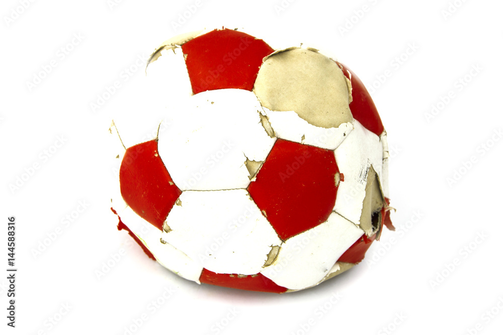 blown a soccer ball in the air landed deformed, worn soccer ball, Stock