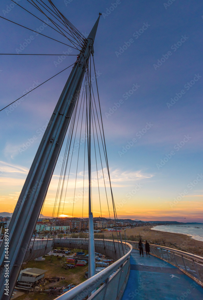 Pescara, Italy - The Ponte del Mare bridge at the dusk, in the canal and port of Pescara city, Abruzzo region