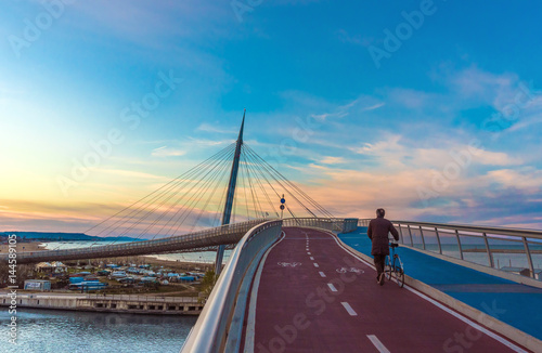 Pescara, Italy - The Ponte del Mare bridge at the dusk, in the canal and port of Pescara city, Abruzzo region