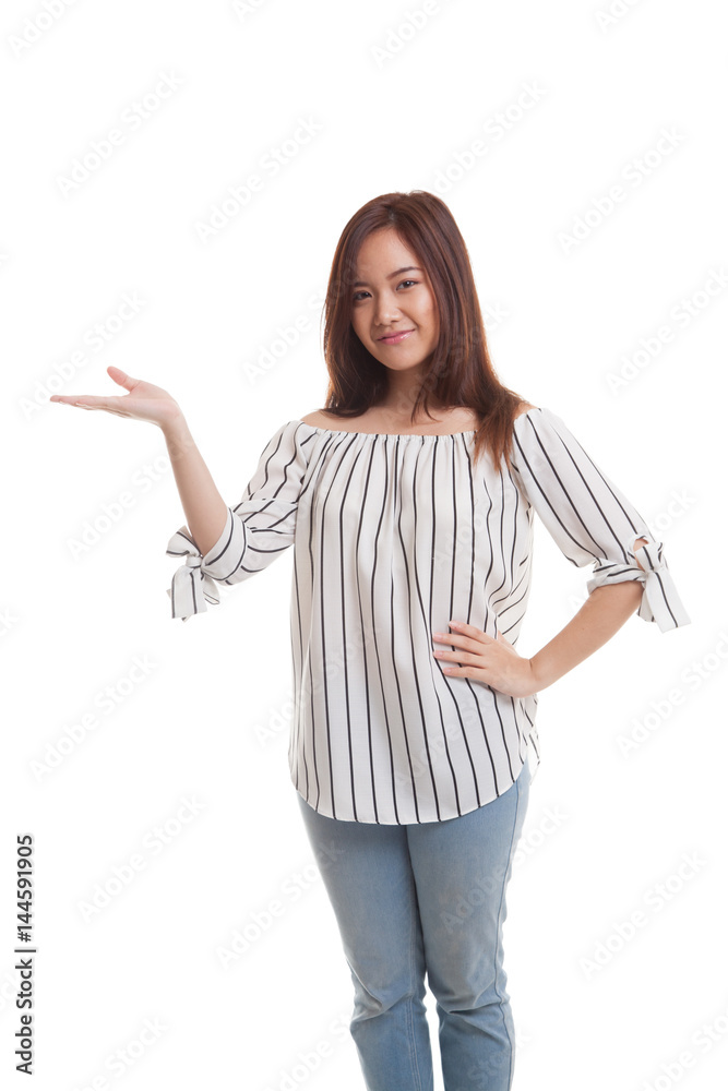 Young Asian woman present with her hand.