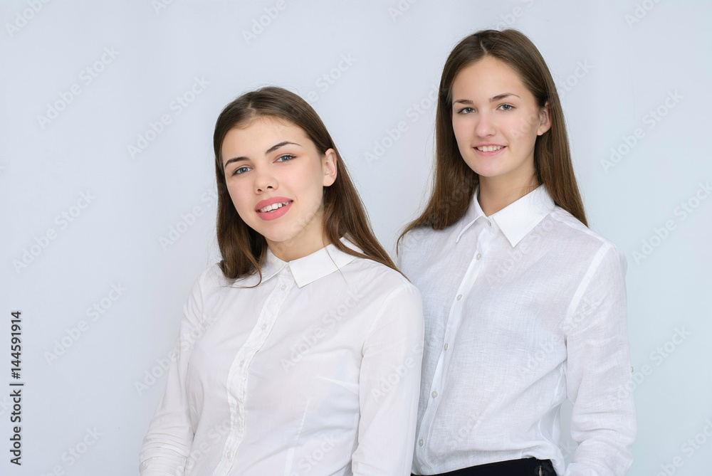 two business models standing with their backs together two business models standing with their backs together