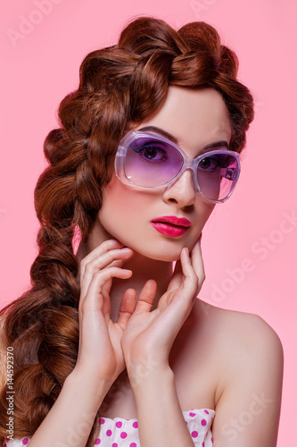 Beautiful girl with bright make-up and sunglasses