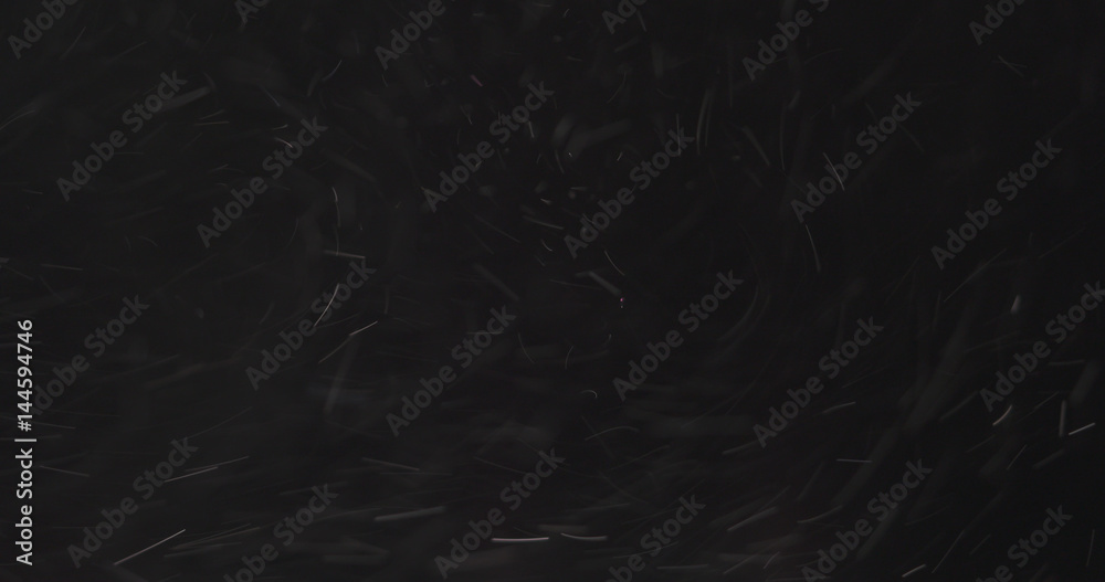 dust particles fly in the air over black background, 4k photo dust particles fly in the air over black background, 4k photo