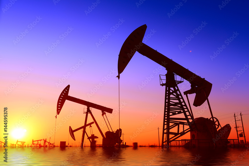 Pumping unit is working, under the sunset Pumping unit is working, under the sunset