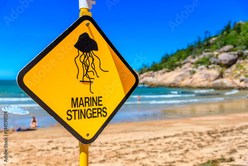 A sign on the beach to warn swimmers in Queensland Australia of marine stingers in the water