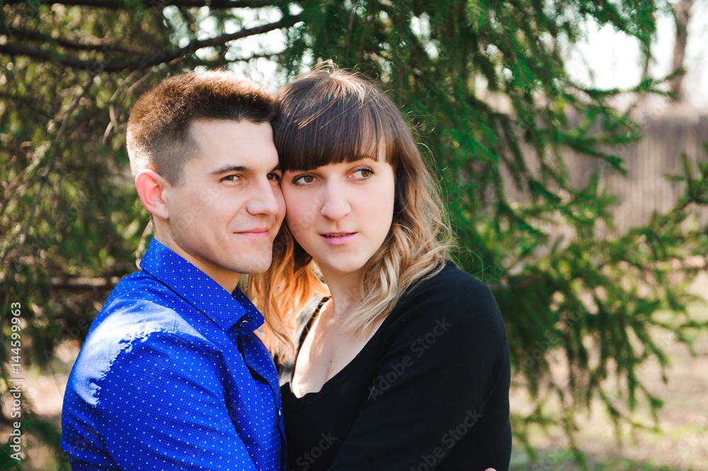 Portrait of young couple in love in a park Portrait of young couple in love in a park