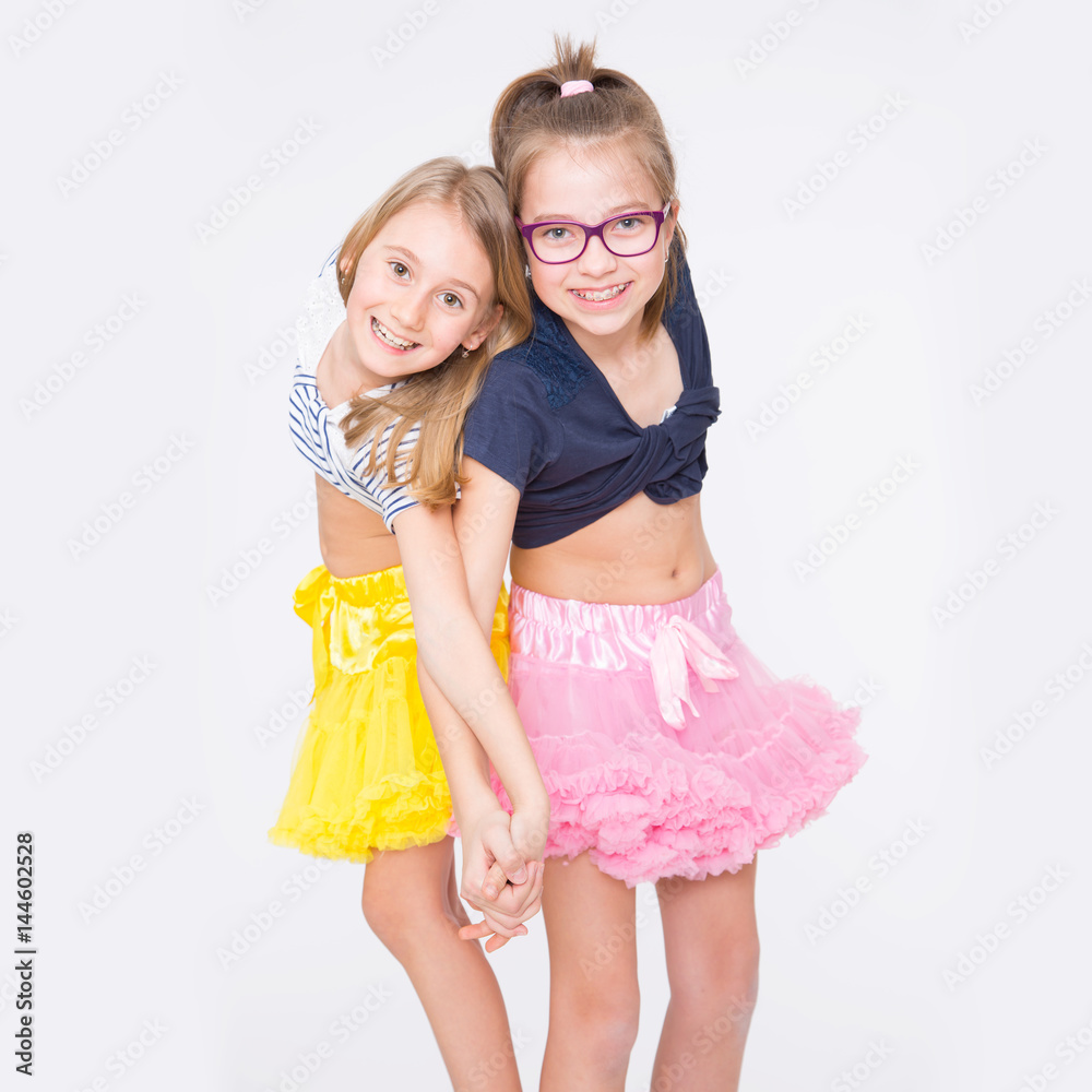 Playful young naughty sisters having fun. Playful young naughty sisters having fun.