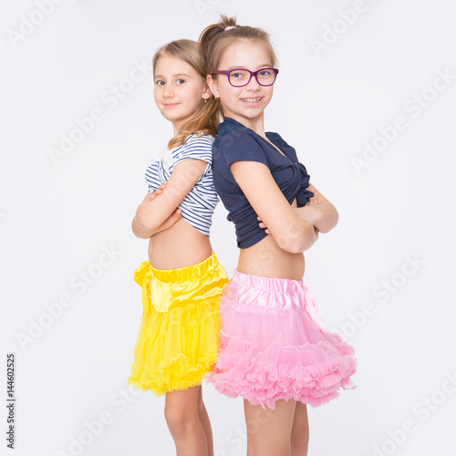 Playful young naughty sisters having fun. photo